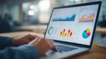 Person reviewing website performance charts and analytics on a laptop